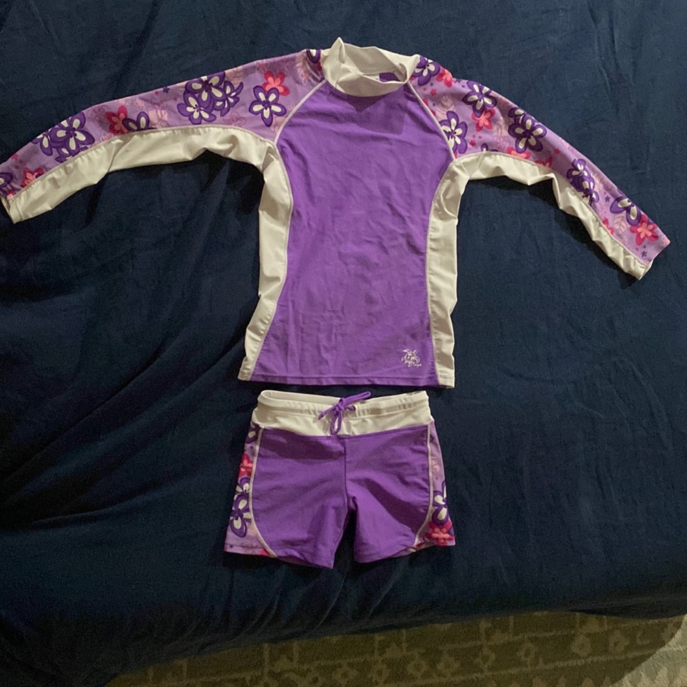Tuga size 7 swimming set. Purple and white with pink rash guard and shorts.